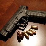 Handgun With Bullets on table in Miami